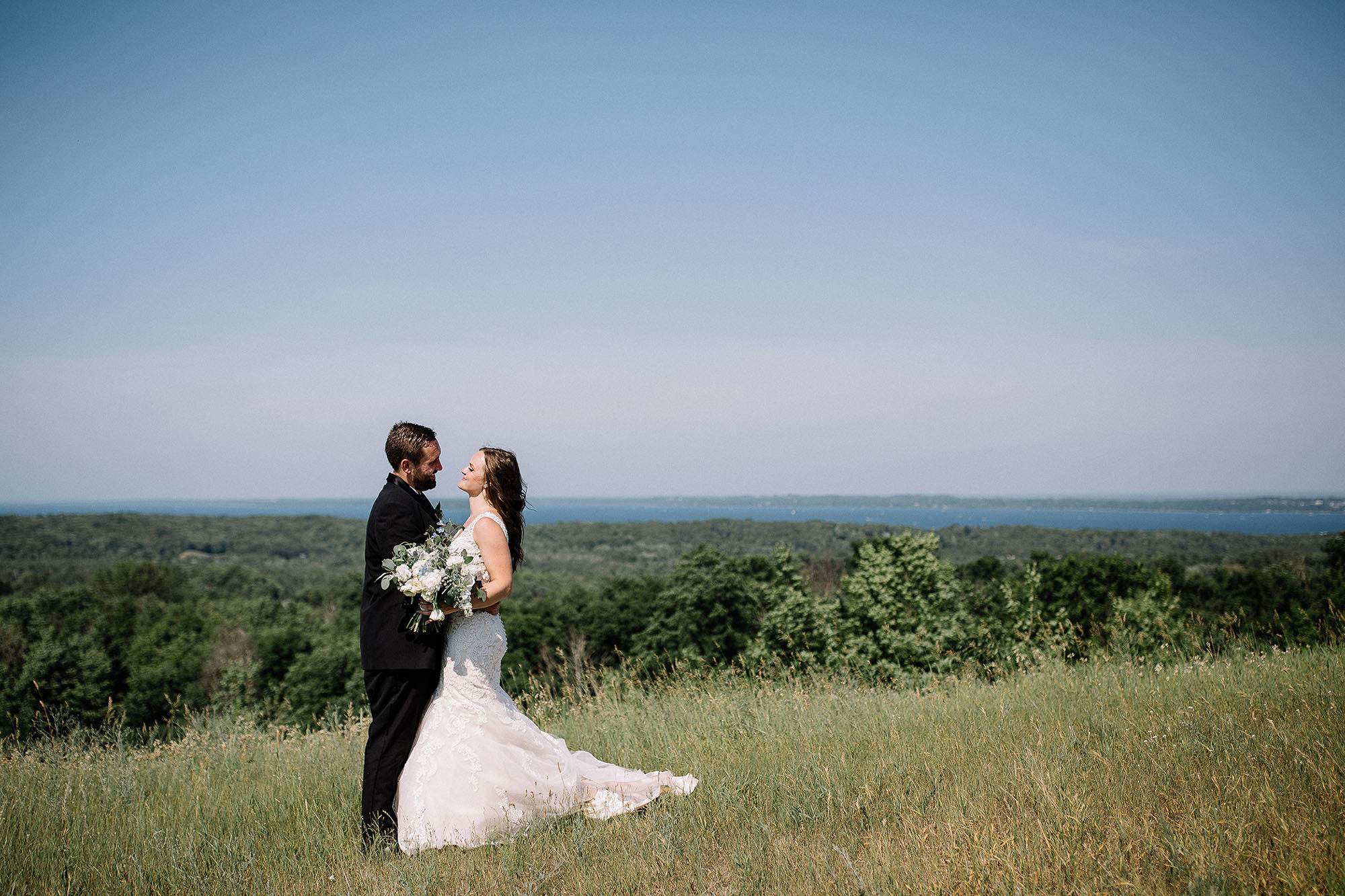 Bay View Weddings Bride and Groom with View of Grand Traverse Bay